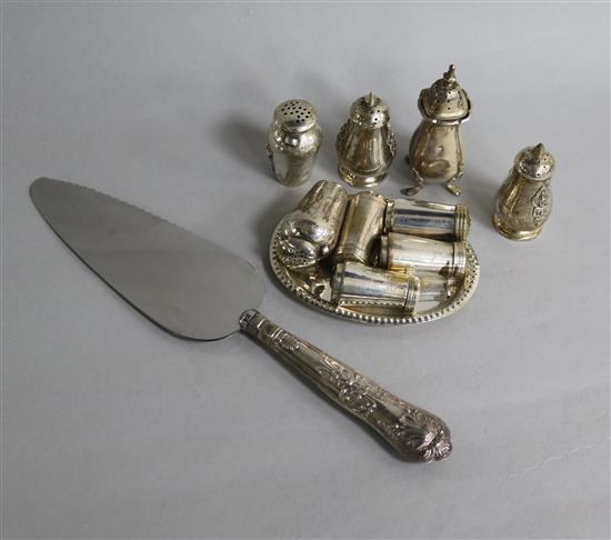 Five assorted silver condiments, four plated condiments and a small tray and a silver handled cake knife.